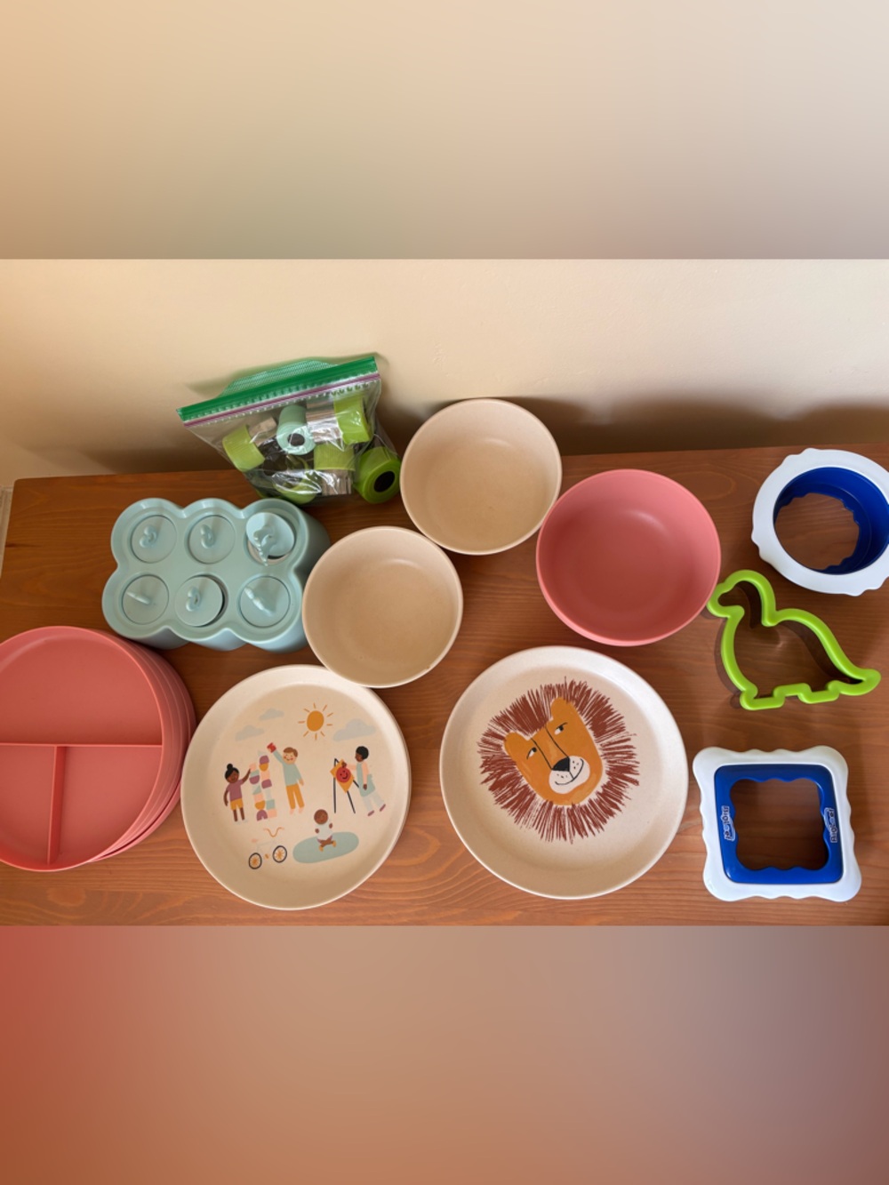 Collection of toddler bowls, plates, sandwich cutters, fruit veg shapers etc